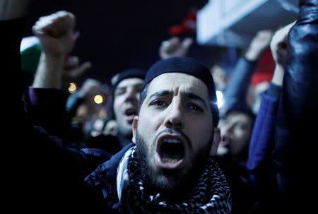 Demonstrators shout slogans during a protest against the U.S. intention to move its embassy to Jerusalem and to recognise the city of Jerusalem as the capital of Israel, near the U.S. Consulate in Istanbul, Turkey, December 6, 2017. REUTERS/Osman Orsal