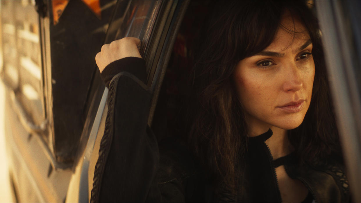  Rachel Stone looks pensive as she looks out of a car window in the Heart of Stone movie 