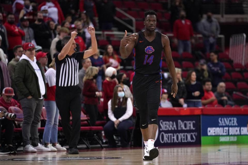 Emmanuel Akot celebrates a late 3-pointer that helped Boise State defeat Fresno State 68-63 in overtime Friday at Save Mart Center in Fresno, California.