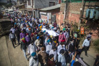 FILE - In this Oct. 8, 2021, file photo, Sikh community members carry the body of slain Supinder Kaur, a school principal during her funeral procession in Srinagar, India. A spate of recent killings has rattled Indian-controlled Kashmir, with violence targeting local minority members and Indian civilians from outside the disputed region. (AP Photo/Mukhtar Khan, File)