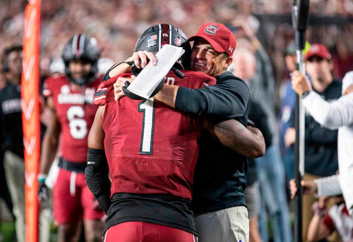 South Carolina Gamecocks head coach Shane Beamer hugs running back MarShawn Lloyd (1) after scoring a touchdown against Texas A&M at Williams-Brice Stadium in Columbia, SC on Saturday, Oct. 22, 2022.