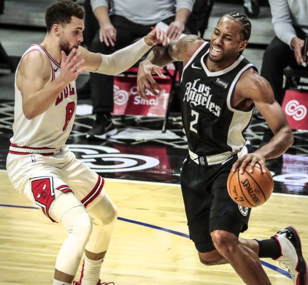 Clippers forward Kawhi Leonard (2) drives against Bulls guard Zach LaVine on Jan. 10, 2020, at Staples Center.