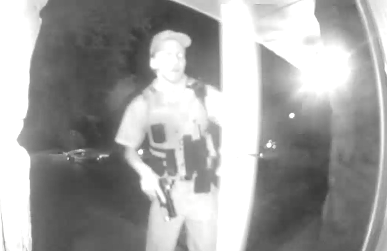 A still from a doorbell camera video shows an officer with his weapon drawn as he's about to enter a Fayetteville home where Jada Johnson, 22, was shot and killed by Fayetteville police July 1, 2022. Cumberland County Superior Court Judge Jim Ammons ruled Jan. 4, 2023, that Johnson's grandparents and their attorney could view body camera footage from the shooting but could not publicly comment on the contents of the footage.