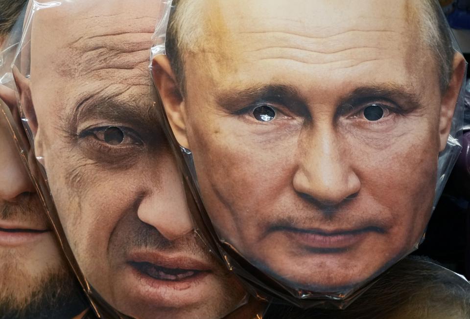 FILE - Face masks depicting Russian President Vladimir Putin, right, and owner of private military company Wagner Group Yevgeny Prigozhin are displayed among others for sale at a souvenir shop in St. Petersburg, Russia, on June 4, 2023. Prigozhin was aboard a plane that crashed north of Moscow on Wednesday, Aug. 23, 2023 killing all 10 people on board. On Sunday, Russia's Investigative Committee said forensic and genetic testing identified all 10 bodies recovered from the crash, and the identities “conform with the manifest.” (AP Photo/File)