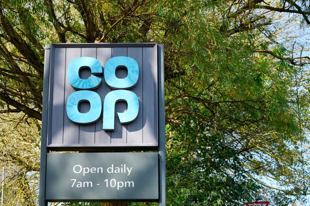 Co-op sign in rural setting ,UK