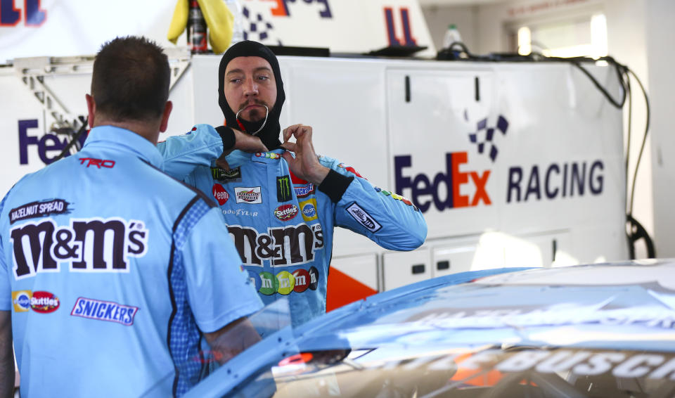 Kyle Busch, right, waits to begin qualifying for a NASCAR Cup Series auto race at Las Vegas Motor Speedway, Friday, Sept. 13, 2019, in Las Vegas. (Chase Stevens/Las Vegas Review-Journal via AP)