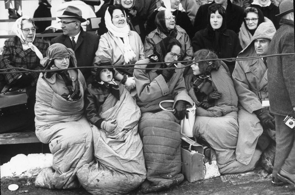 People standing in the cold to watch the (Photo by Leonard Mccombe/The LIFE Picture Collection via Getty Images / The LIFE Picture Collection via)