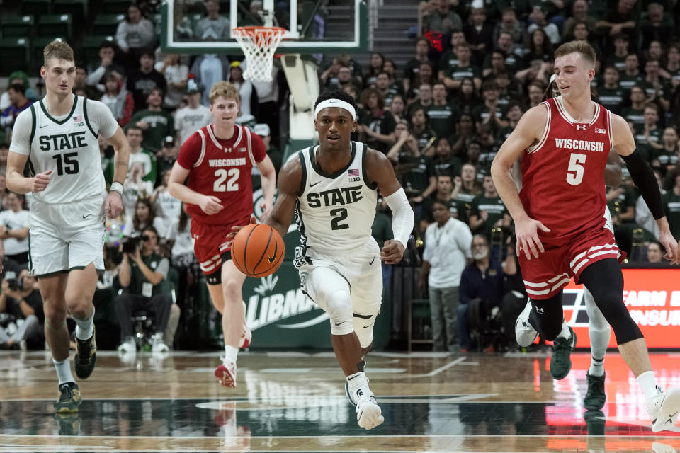 Michigan State guard Tyson Walker (2) brings the ball up court during the second half of an NCAA college basketball game against Wisconsin, Tuesday, Dec. 5, 2023, in East Lansing, Mich. (AP Photo/Carlos Osorio)