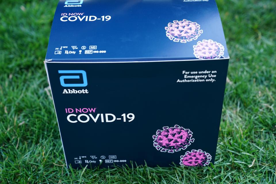 A box containing a 5-minute test for COVID-19 from Abbott Laboratories is pictured during the daily briefing on the novel coronavirus, COVID-19, in the Rose Garden of the White House in Washington, DC, on March 30, 2020. (Photo by MANDEL NGAN / AFP) (Photo by MANDEL NGAN/AFP via Getty Images)