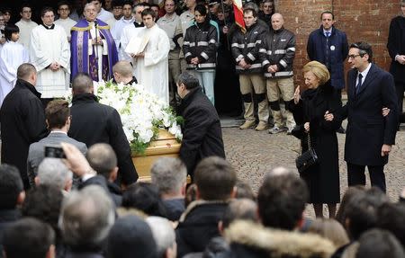 Maria Franca and Giovanni (R), wife and son of Michele Ferrero, follows his coffin during the funeral service in Alba February 18, 2015. REUTERS/Giorgio Perottino