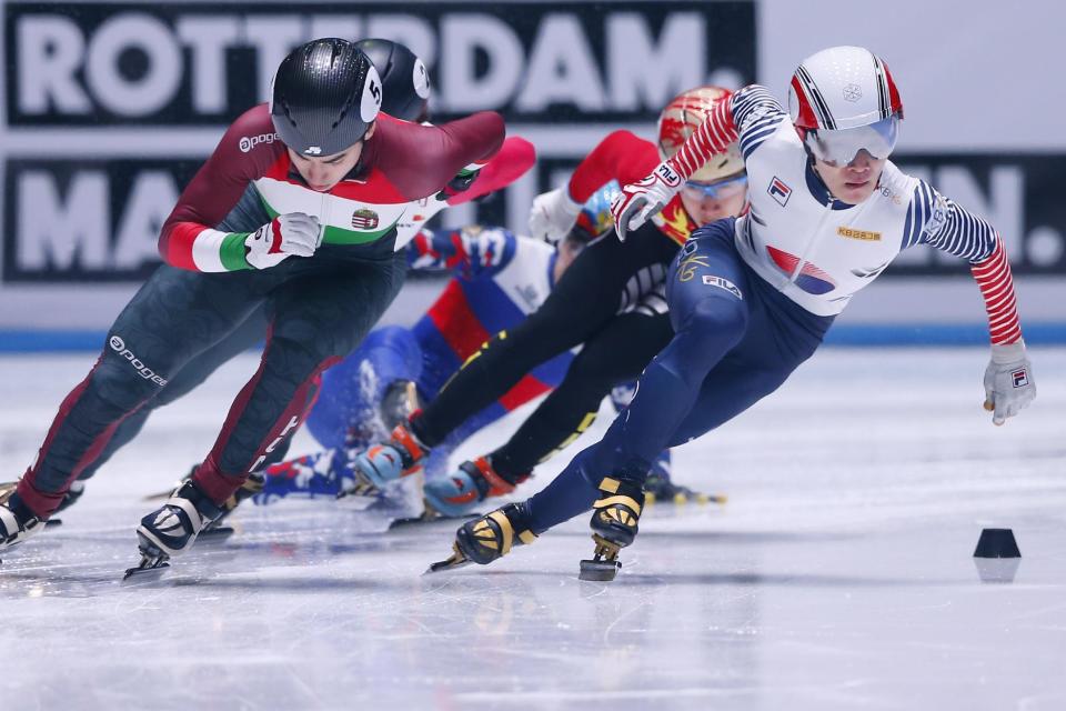 Korea's Yi Ra Seo, right, and Hungary's Shaoang Liu, left, compete in the men's 1,000 meter final of the ISU World Short Track Speed Skating Championships at Ahoy stadium in Rotterdam, Netherlands, Sunday, March 12, 2017. (AP Photo/Peter Dejong)