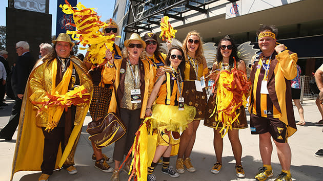 Hawks fans gather outside the MCG.