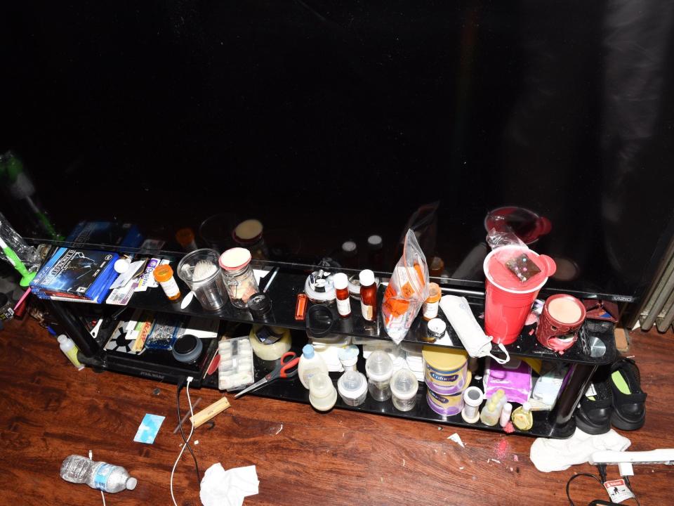 Crime scene photo of Quincy Pierre's bedroom shows Nikolaii's Enfamil, bottles and prescription medications.