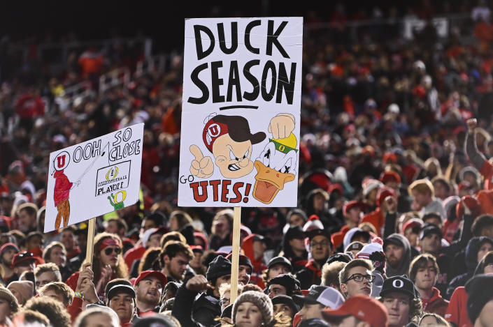 Utah fans hold signs during the second half of an NCAA college football game against Oregon Saturday, Nov. 20, 2021, in Salt Lake City. (AP Photo/Alex Goodlett)