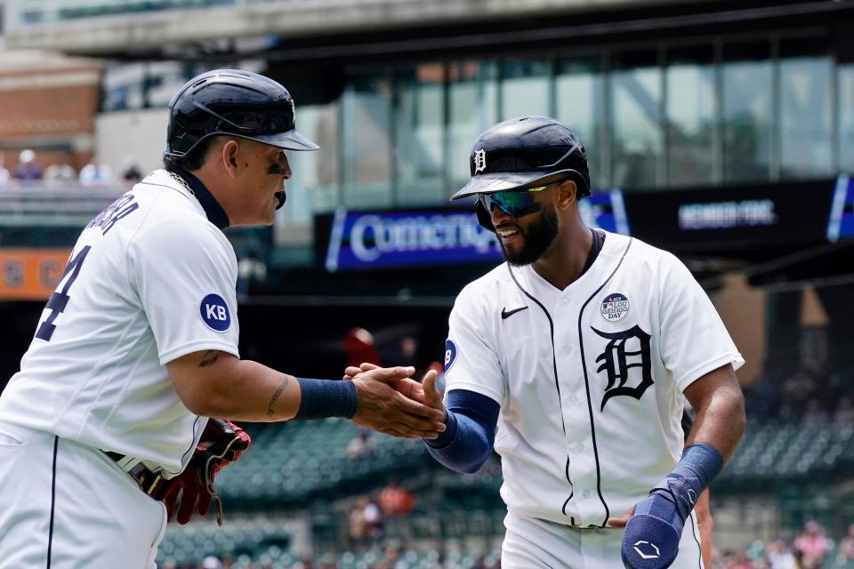 Tigers' Willi Castro, right, is greeted by Miguel Cabrera after scoring during the first inning against the Twins, Thursday, June 2, 2022, in Detroit.