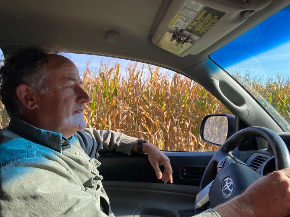 Douglas Beckman drives alongside a corn field Oct. 6 on his farm in Prairie Grove Township.