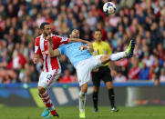 Stoke City's Marc Wilson (left) tussles with Manchester City's Alvaro Negredo during the Barclays Premier League match at the Britannia Stadium, Stoke On Trent.