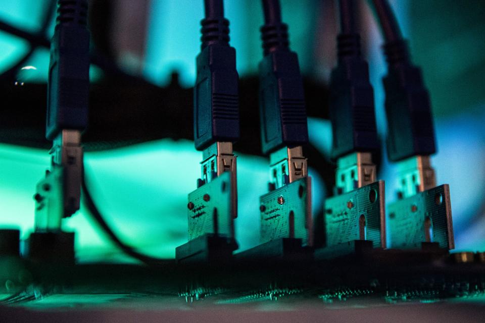 Lights illuminate USB cables inside a 'mining rig' computer, used to mine cryptocurrency. (Akos Stiller/Bloomberg)