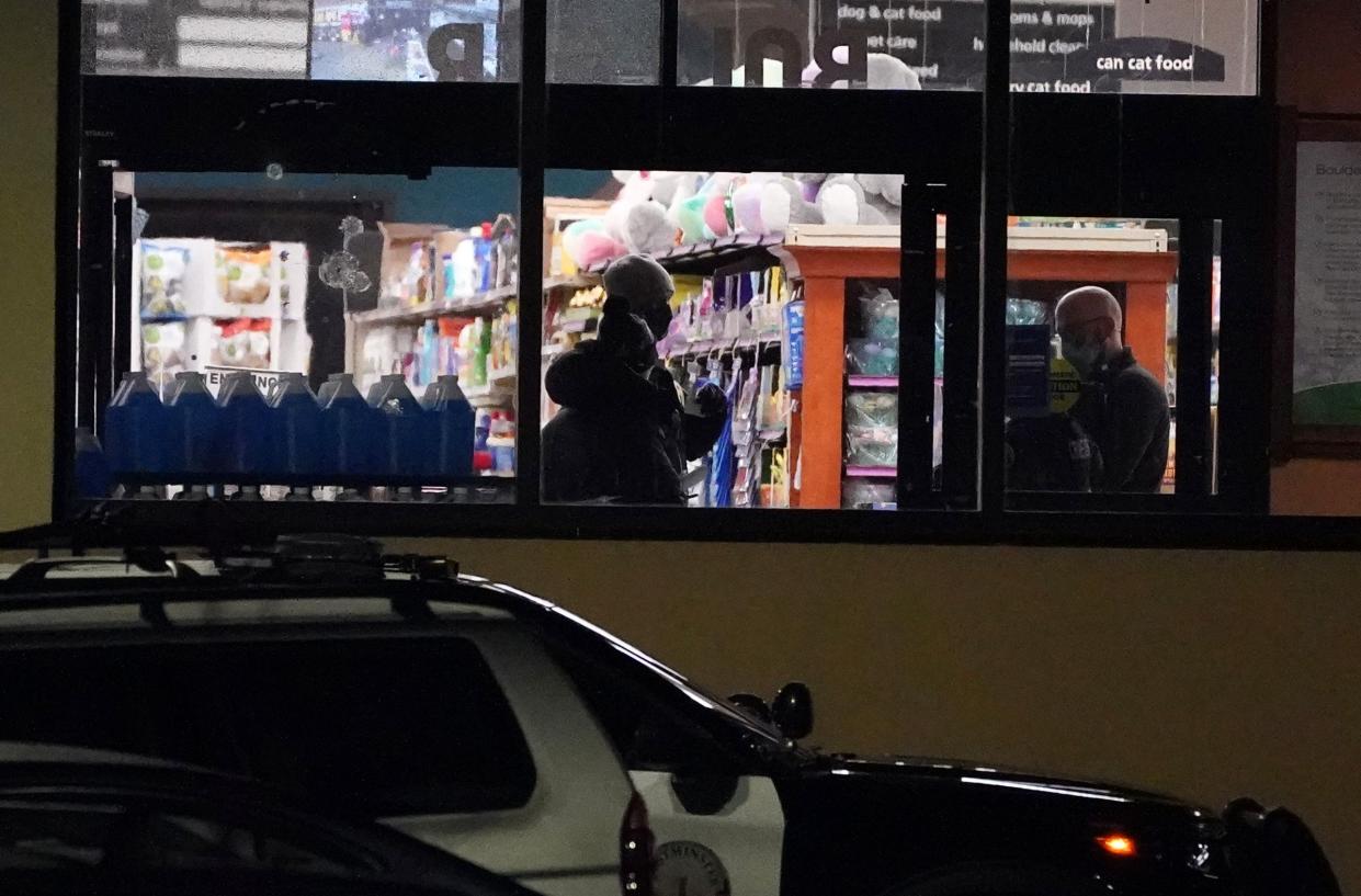 Police continue their investigation at a King Soopers grocery store where authorities say multiple people were killed in a shooting on Monday, March 22, 2021, in Boulder, Colo.