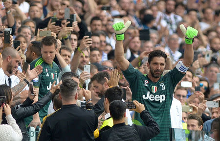 FILE PHOTO: Allianz Stadium, Turin, Italy - May 19, 2018 Juventus' Gianluigi Buffon gestures to the fans as he is substituted off REUTERS/Massimo Pinca/File Photo