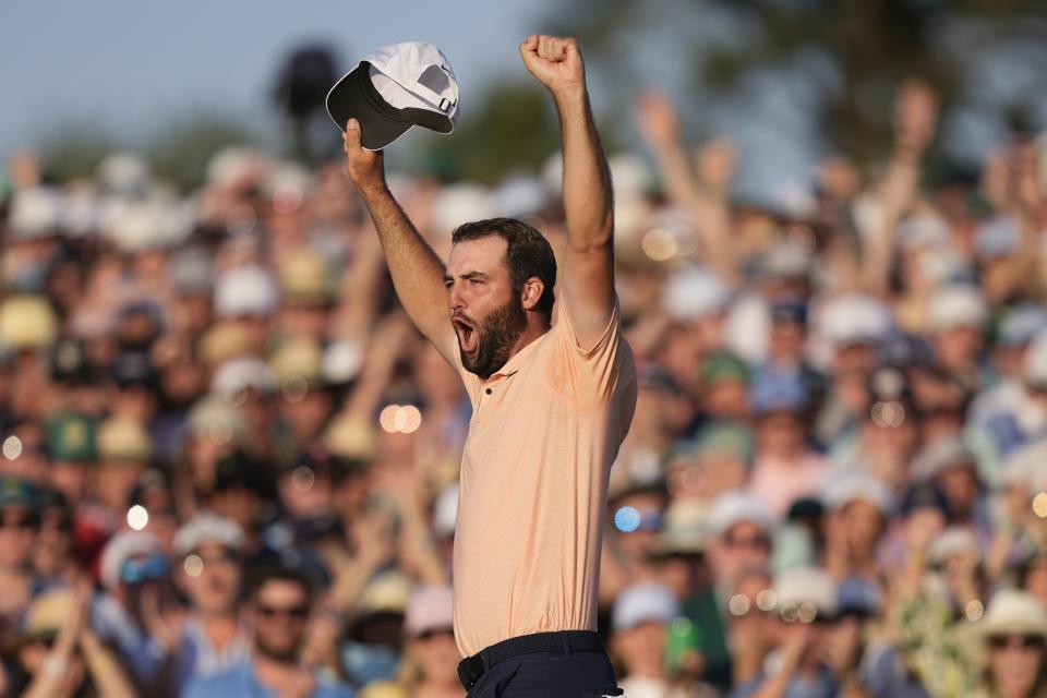 Scottie Scheffler celebrates his win at the Masters golf tournament at Augusta National Golf Club Sunday, April 14, 2024, in Augusta, Ga. (AP Photo/Charlie Riedel)