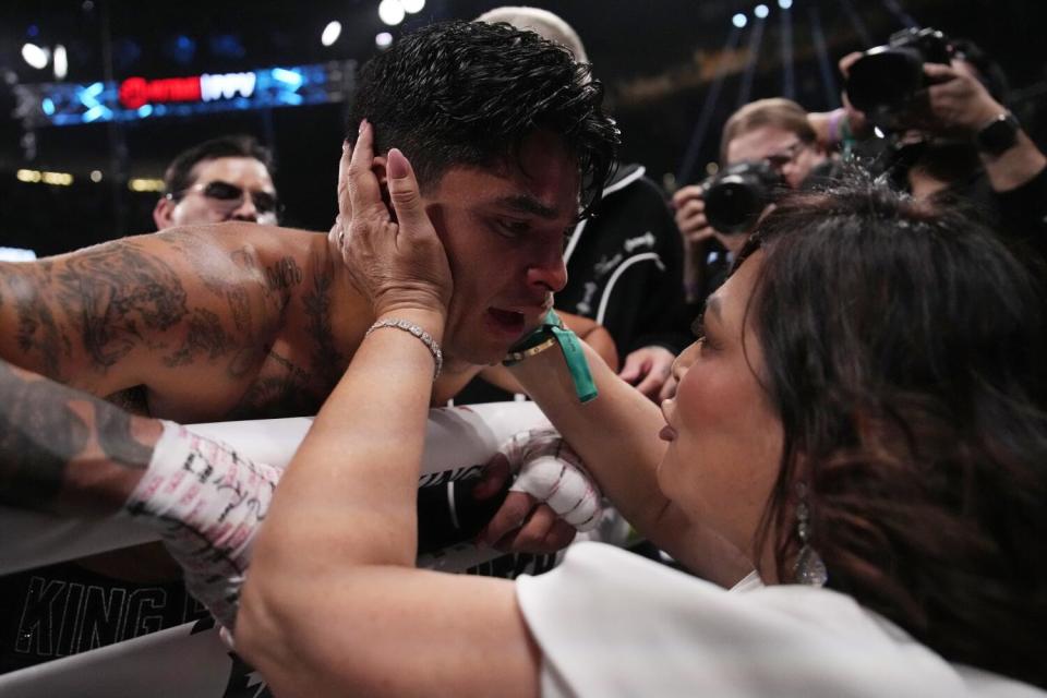 Ryan Garcia is embraced by his m