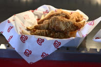 Chicken is for sale at Nationals Park in Washington before an exhibition baseball game between the Washington Nationals and the Washington Nationals Futures, Tuesday, March 26, 2024. Most parks and arenas have a handful of areas that offer salads, gluten free or vegan offerings if fans are willing to hunt a little. But the vast majority of people attending baseball games aren't necessarily looking to eat healthy. (AP Photo/Nick Wass)