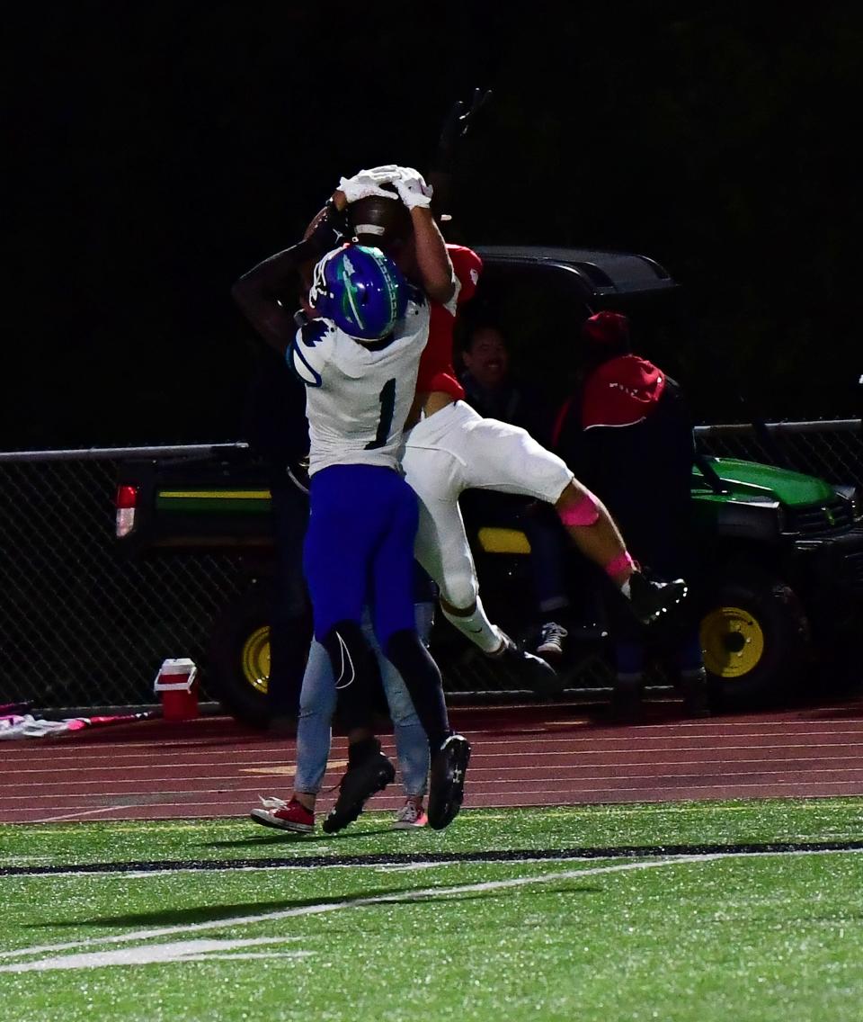 Cameron Calhoun (1) picks off a Milford pass for Winton Woods at the Winton Woods vs. Milford Eastern Cincinnati Conference football game, Oct. 7. Calhoun has decommitted from UC football.