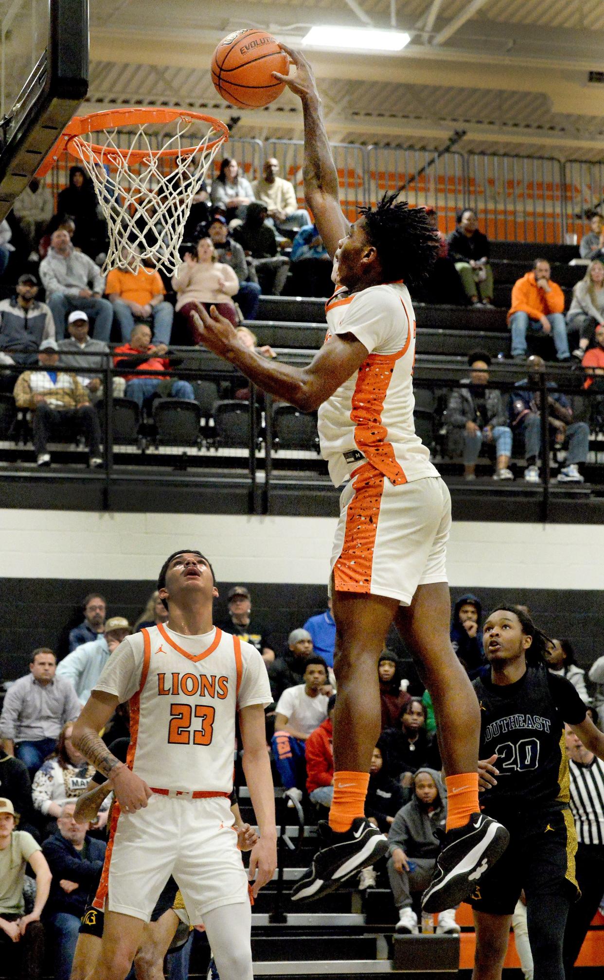 Lanphier's Shaunassey Hatchett Jr. goes up for a slam dunk during the game against Southeast Wednesday, February 21, 2024.