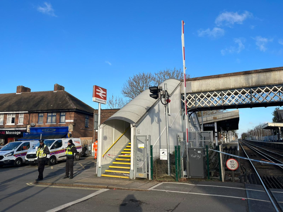Police at the scene of the double stabbing at Strawberry Hill train station (Ayan Omar)