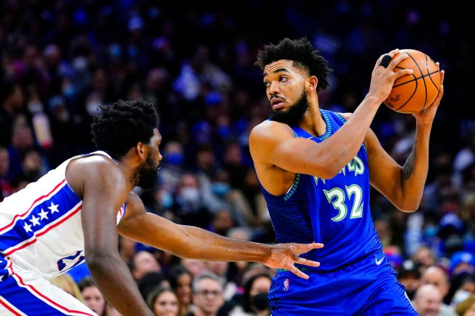 The Sixers' Joel Embiid, left, guards the Timberwolves' Karl-Anthony Towns on Saturday night.