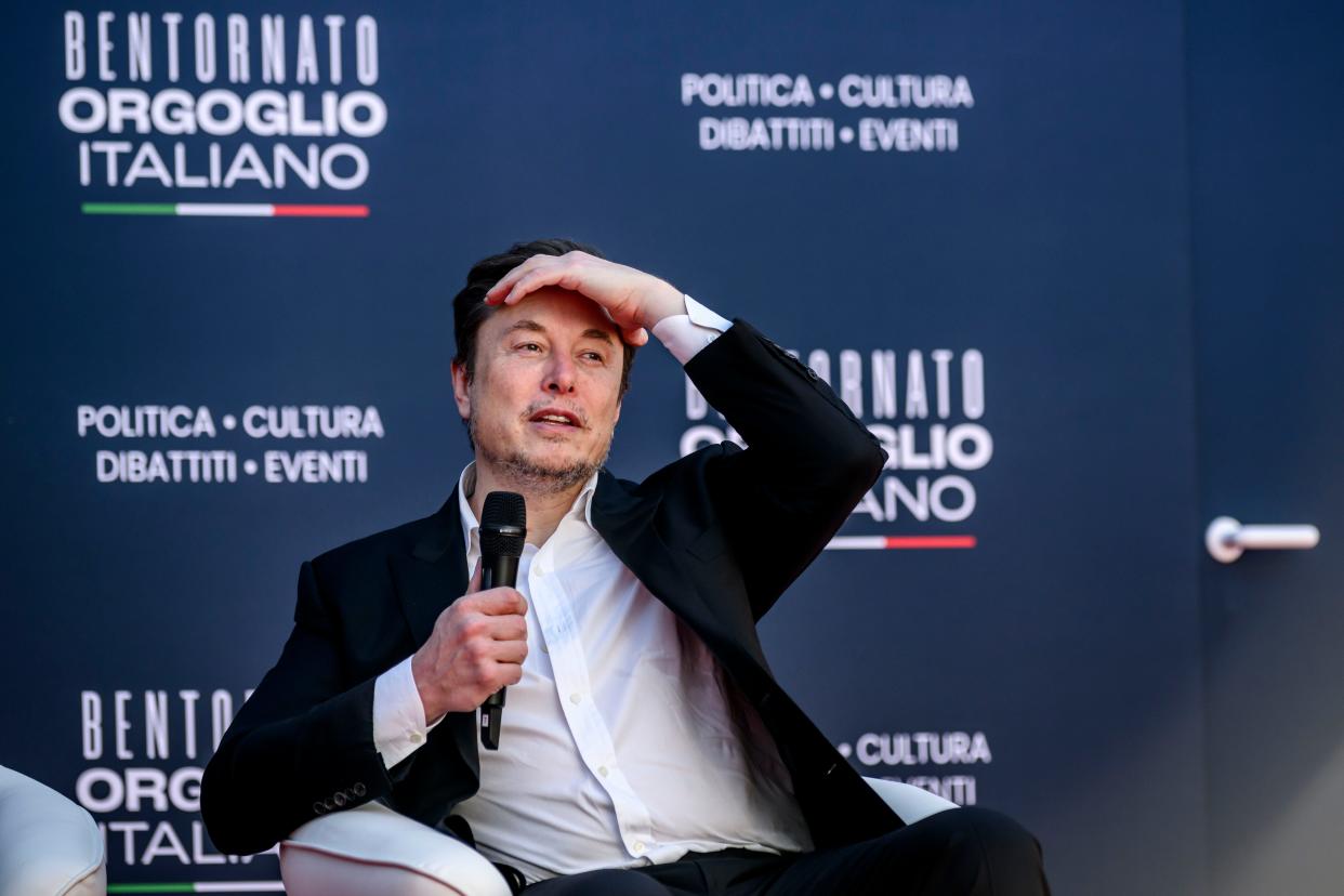 Elon Musk speaking at an event.