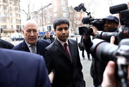 Navinder Sarao (C) arrives at Westminster Magistrates' Court in London, Britain February 5, 2016. A London-based trader accused of helping cause the 2010 Wall Street "flash crash" was operating a legitimate trading strategy rather than placing bogus orders to spoof the market, a British court heard on Thursday. REUTERS/Neil Hall - RTX25KEE