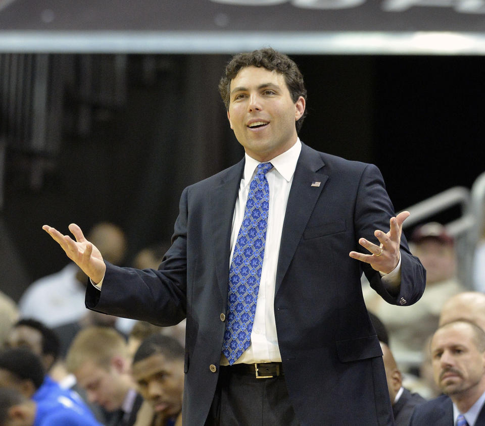 Memphis head coach Josh Pastner reacts to a call during the second half of an NCAA college basketball game against Louisville, Thursday, Jan. 9, 2014, in Louisville, Ky. Memphis defeated Louisville 73-67. (AP Photo/Timothy D. Easley)