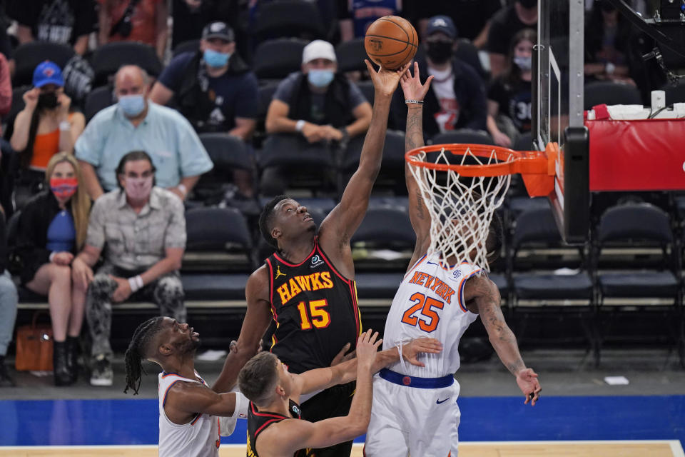 Atlanta Hawks' Clint Capela (15) drives to the basket through New York Knicks defenders during the second half of Game 1 of an NBA basketball first-round playoff series, Sunday, May 23, 2021, in New York. (AP Photo/Seth Wenig, Pool)