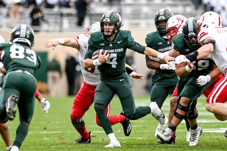 Michigan State's Sam Leavitt runs for a first down against Nebraska during the fourth quarter on Saturday, Nov. 4, 2023, at Spartan Stadium in East Lansing.