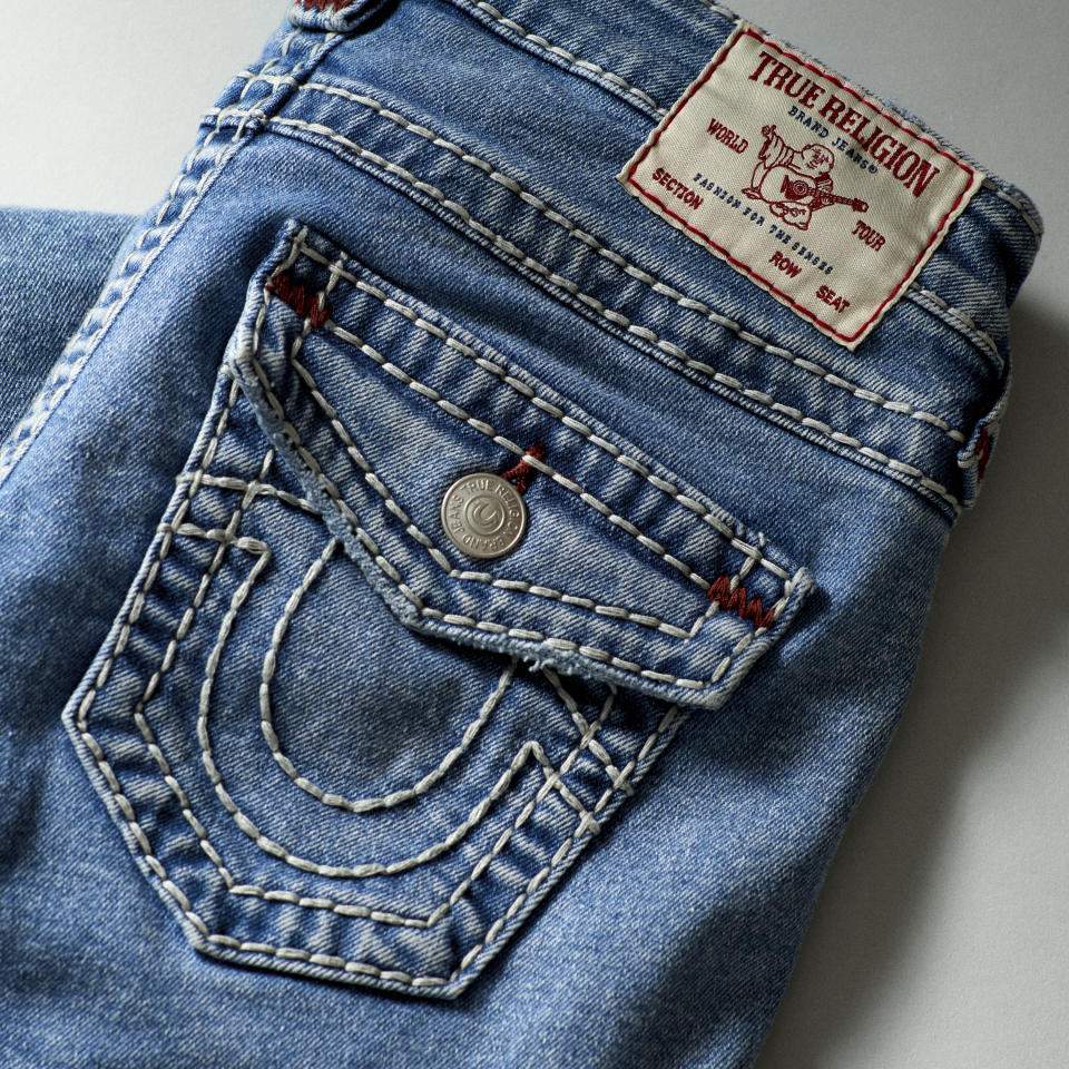 Jeans with the distinctive guitar-playing Buddha logo and stitching.