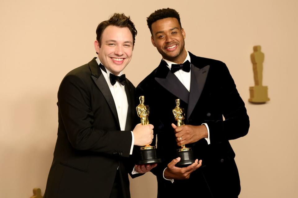 From left, Halifax filmmaker Ben Proudfoot and his collaborator Kris Bowers pose after winning the best documentary short film award for The Last Repair Shop during the 96th Oscars at Ovation Hollywood on March 10, 2024 in Hollywood, Calif.