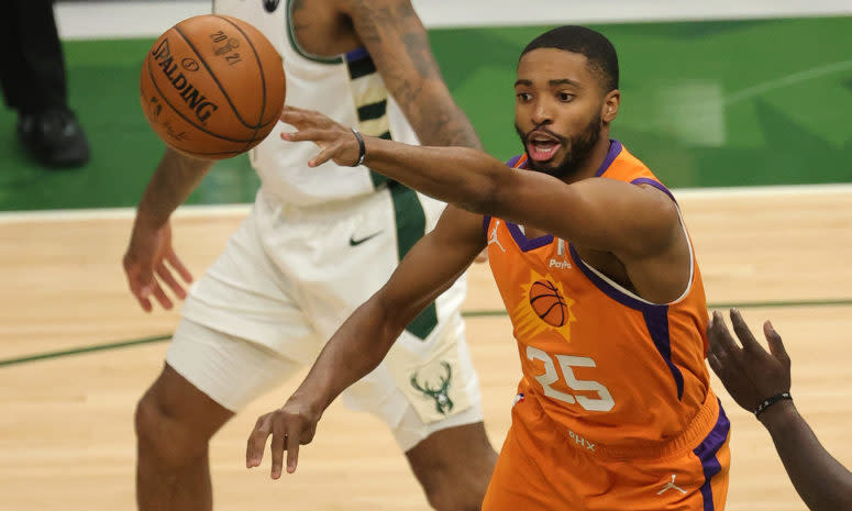 Suns wing Mikal Bridges passes the ball.