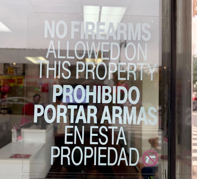 A T-Mobile store in New York City asks customers to leave their guns at home.