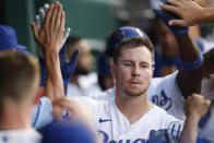 Kansas City Royals' Ryan O'Hearn is congratulated in the dugout for his three-run home run during the fourth inning of the team's baseball game against the Detroit Tigers at Kauffman Stadium in Kansas City, Mo., Friday, July 23, 2021. (AP Photo/Colin E. Braley)