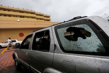 Broken glass is seen in a car, after Hurricane Earl hits, in Belize City, Belize August 4, 2016. REUTERS/Henry Romero