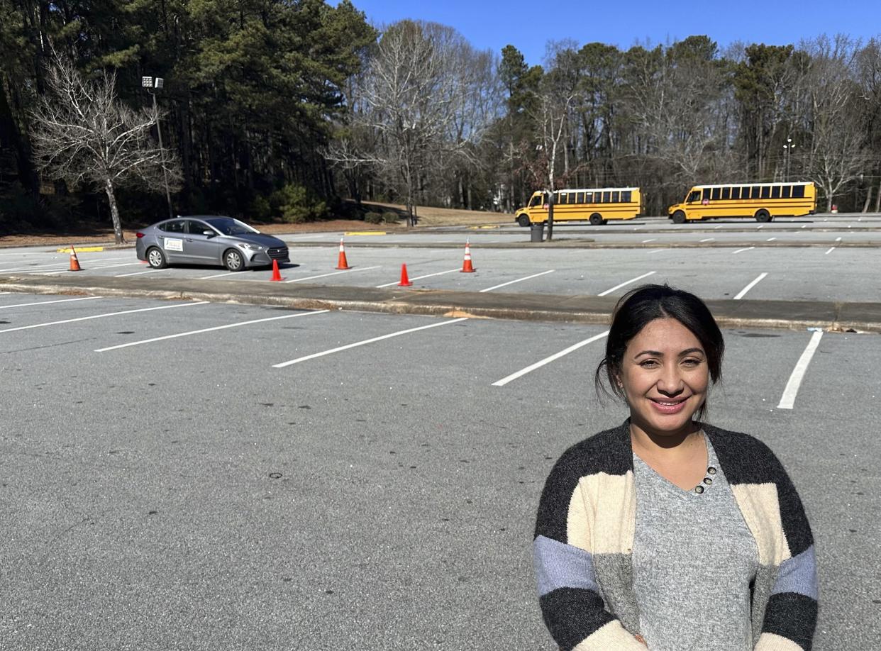 Nancy Gobran, instructor and owner of Safety Driving School, poses in an empty parking lot 