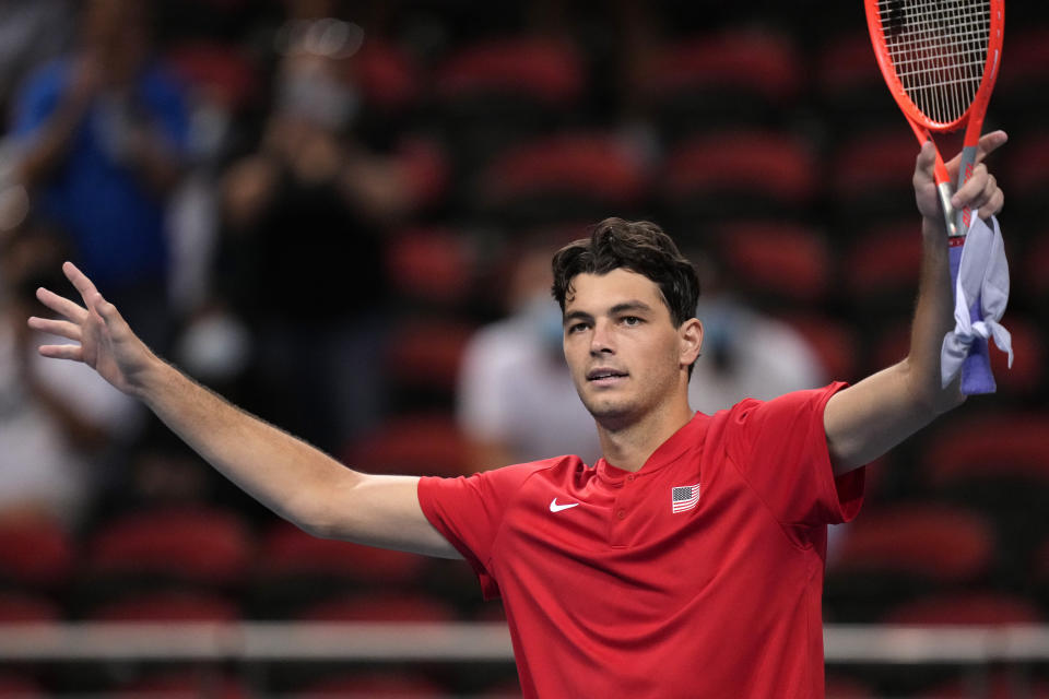 United States' Taylor Fritz waves after his win over Canada's Felix Auger-Aliassime in their match at the ATP Cup tennis tournament in Sydney, Sunday, Jan. 2, 2022. (AP Photo/Rick Rycroft)