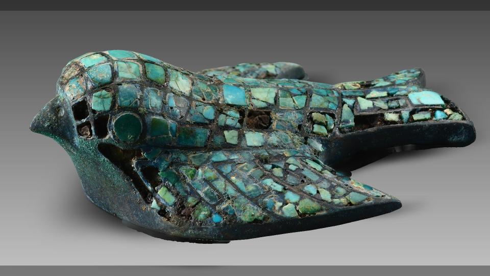 This bronze bird figurine inlaid with pieces of turquoise is among the roughly 3000 year-old artifacts unearthed from the elite tombs at the Zhaigou site.