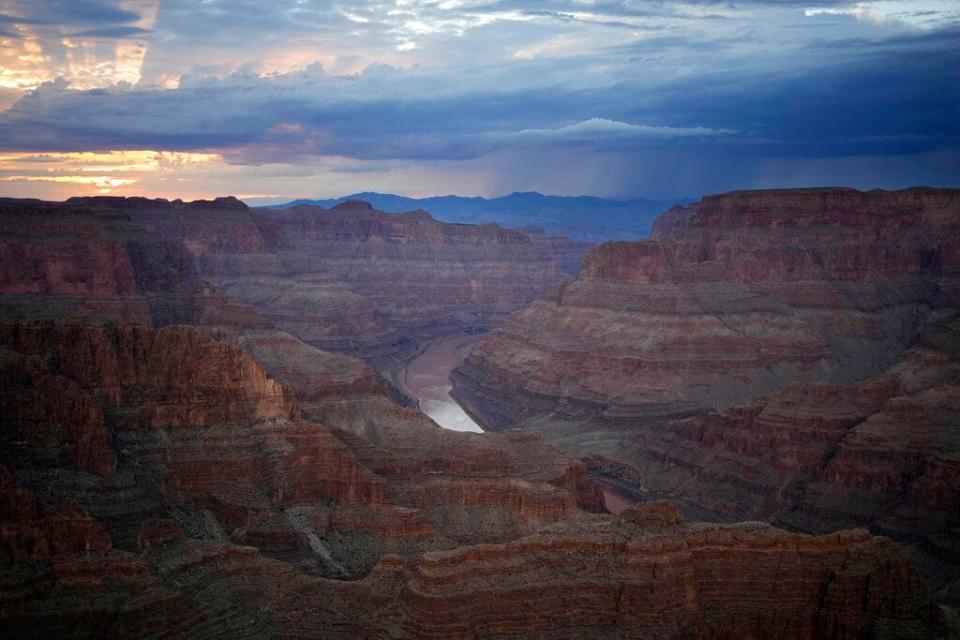 FILE - The Colorado River flows through the Grand Canyon on the Hualapai reservation Monday, Aug. 15, 2022, in northwestern Arizona. Six western states that rely on water from the Colorado River have agreed on a plan to dramatically cut their use. California, the state with the largest allocation of water from the river, is the holdout. (AP Photo/John Locher, File)