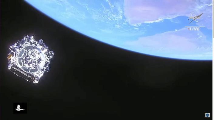 james webb space telescope in space above earth