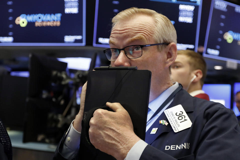 Trader Dennis Maguire works on the floor of the New York Stock Exchange, Thursday, July 18, 2019. U.S. stocks moved lower in early trading on Wall Street Thursday after Netflix reported a slump in new subscribers and dragged down communications companies. (AP Photo/Richard Drew)