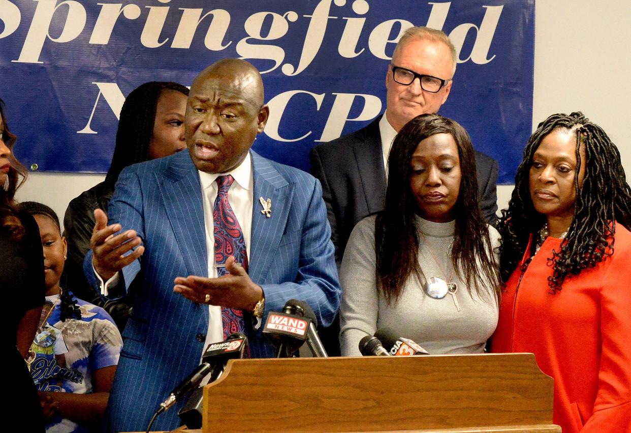 Nationally know civil rights attorney Ben Crump, left, who has been retained by the family of Earl Moore Jr., speaks during a press conference at the Springfield NAACP with the mother of Earl Moore Jr., Rosena Washington, center and NAACP Springfield branch president and state director Teresa Haley, right, Thursday Jan. 19, 2023.