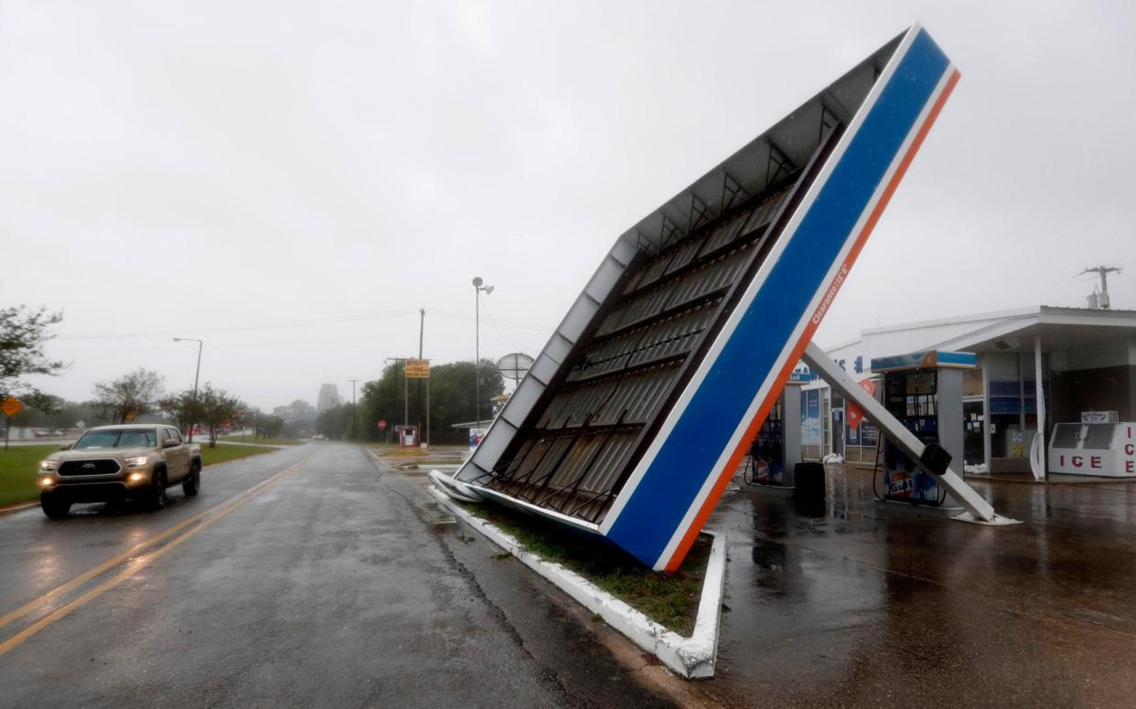 Barry was downgraded to a tropical storm but still inflicted widespread damage - AP